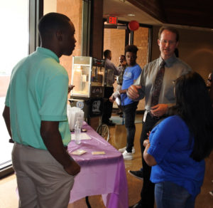 Dr. Hurst talks with students.