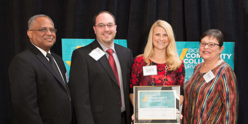 Staff pose with CCC's Digital Community Colleges Survey Award.